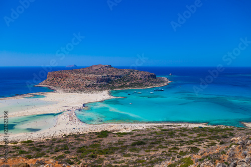 Amazing view of Balos Lagoon with magical turquoise waters, lagoons, tropical beaches of pure white sand and Gramvousa island on Crete, Greece