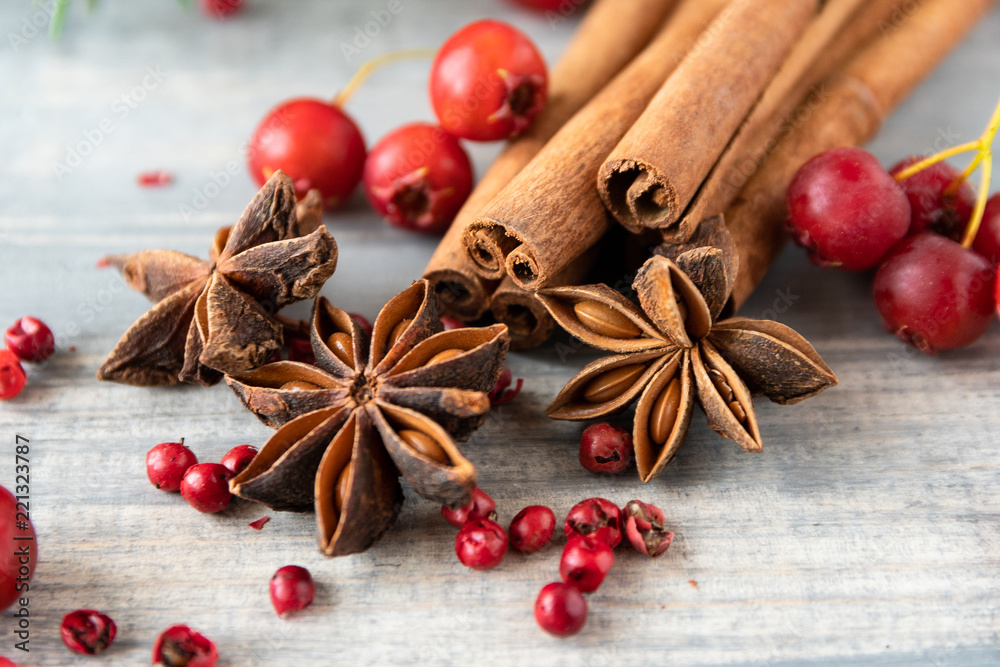 anise seeds, cinnamon sticks and pink pepper - spice for cooking meats, cakes or mulled wine on wooden table, selective focus and copyspace, Christmas 2019, new year 2019 anise seeds, cinnamon sticks and pink pepper - spice for cooking meats, cakes or mulled wine on wooden table, selective focus and copyspace, Christmas 2019, new year 2019