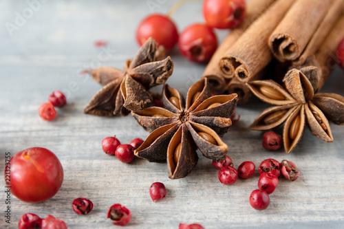 anise seeds, cinnamon sticks and pink pepper - spice for cooking meats, cakes or mulled wine on wooden table, selective focus and copyspace, Christmas 2019, new year 2019