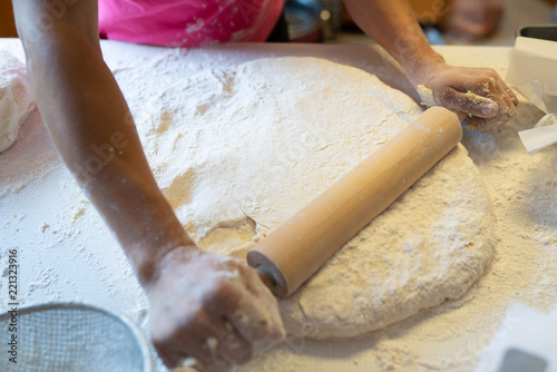 Making of the dough with a rolling pin.