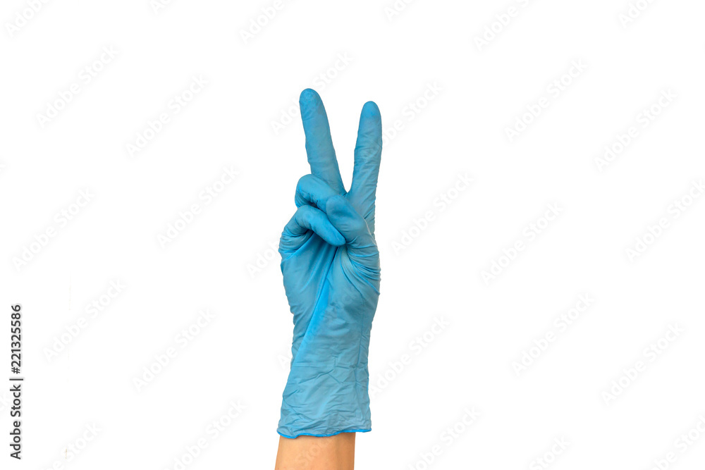 Isolate woman's hand showing two fingers in a blue rubber glove on a white background. The gesture of victory. The concept of successful work of a chef of a surgeon or cleaning Isolate woman's hand showing two fingers in a blue rubber glove on a white background. The gesture of victory. The concept of successful work of a chef of a surgeon or cleaning