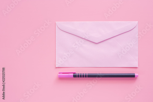 Pink envelope with a pen fo...