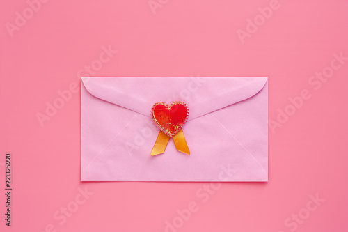 Pink envelope with red hear...