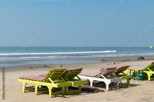 Relaxing beach view with beds at Morjim beach, Goa in India