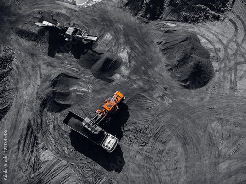 Open pit mine, extractive industry, Loading of coal, top view aerial drone
