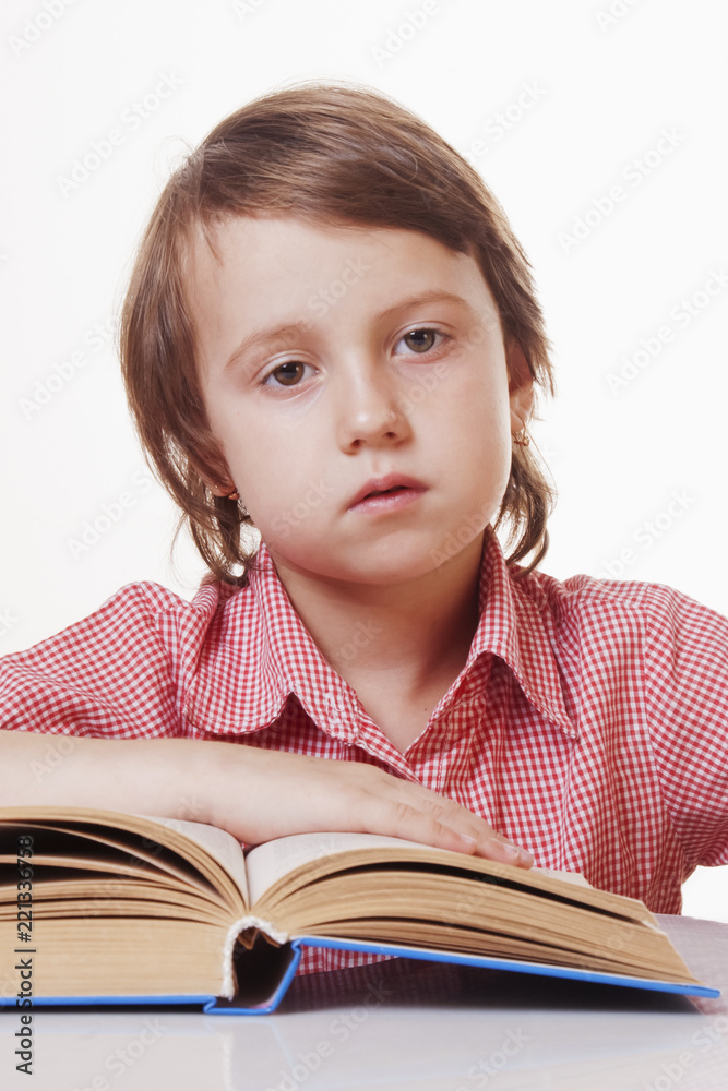 Portrait of beautiful little child girl learns to read (education, childhood, development concept) Portrait of beautiful little child girl learns to read (education, childhood, development concept)