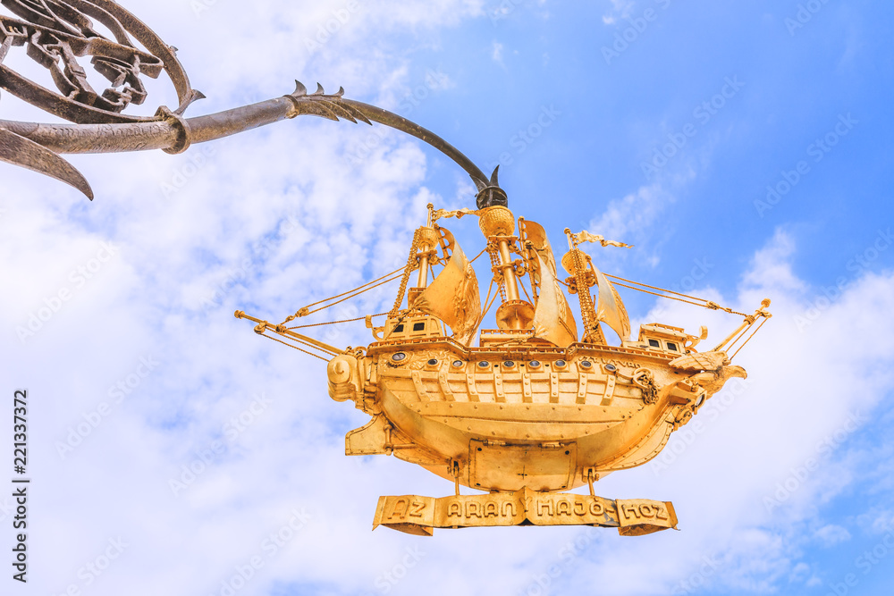Decoratif sailing boat floating in the blue sky Decoratif sailing boat floating in the blue sky