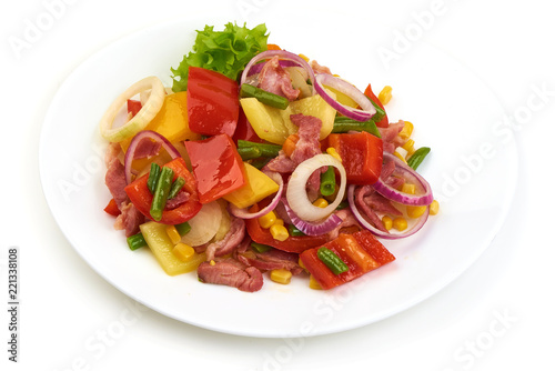 Healthy snack of assorted farm fresh roast vegetables in a white plate, isolated on white backgound.