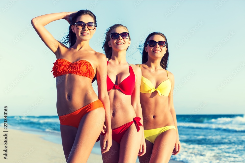 Group of young adults partying at the beach Group of young adults partying at the beach