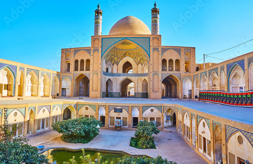 The arched niches in courtyard of Agha Bozorg Mosque, Kashan, Iran photo