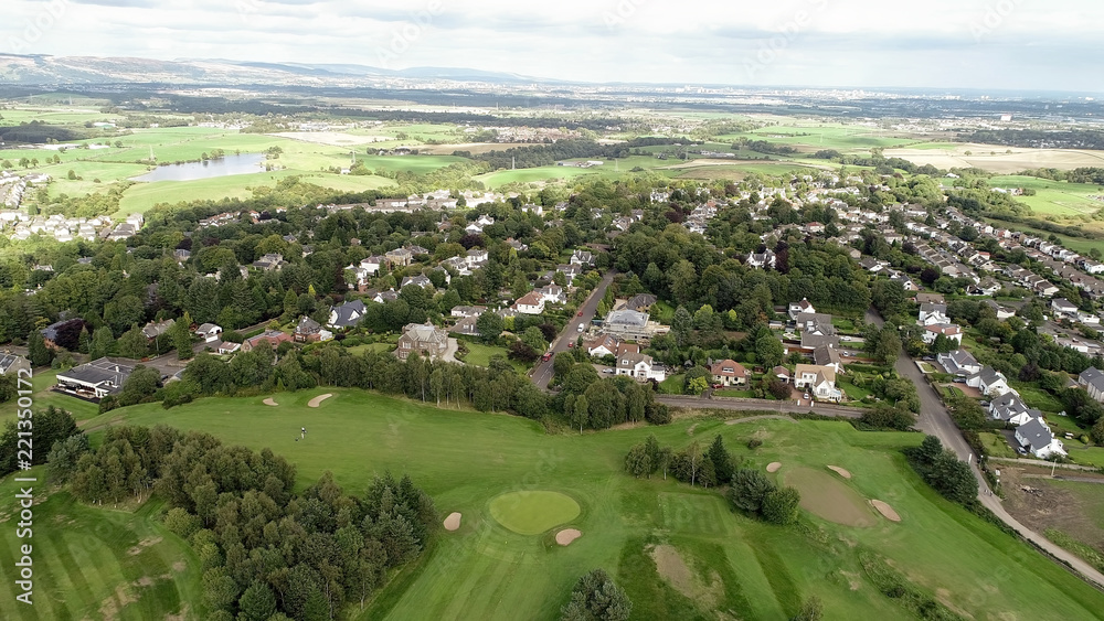 Aerial view over the village of Bridge of Weir and surrounding countryside.