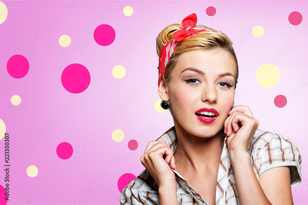 Portrait of woman holding megaphone, dressed in pin-up style Portrait of woman holding megaphone, dressed in pin-up style