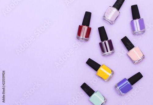 Nail work flat lay concept. Stylish trendy female manicure. top view of a set of jars with gel-varnish for nails of different trend colors and shades with space for text