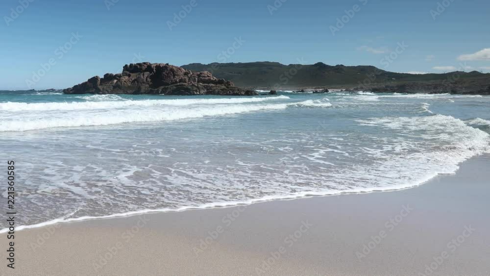 the beautiful pedrosa beach on the costa da morte coast of galicia in spain on a summer morning the beautiful pedrosa beach on the costa da morte coast of galicia in spain on a summer morning
