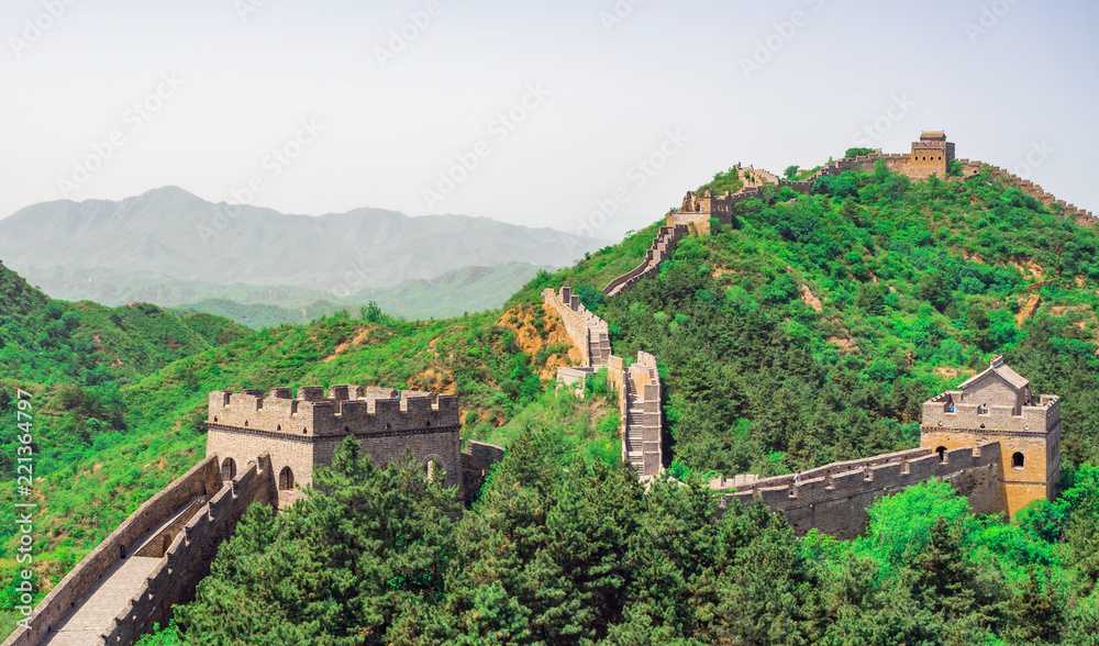 The Great Wall Jinshanling section with green trees in a sunny day, Beijing, China