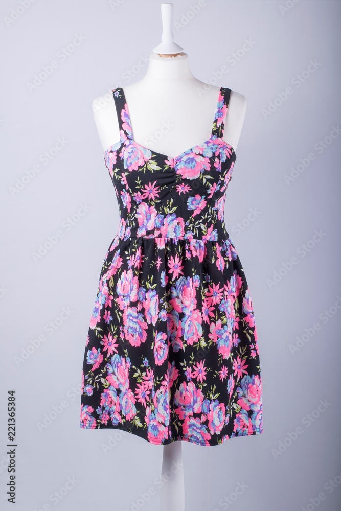 Tailors Mannequin dressed in a Black and Pink Floral Dress Tailors Mannequin dressed in a Black and Pink Floral Dress