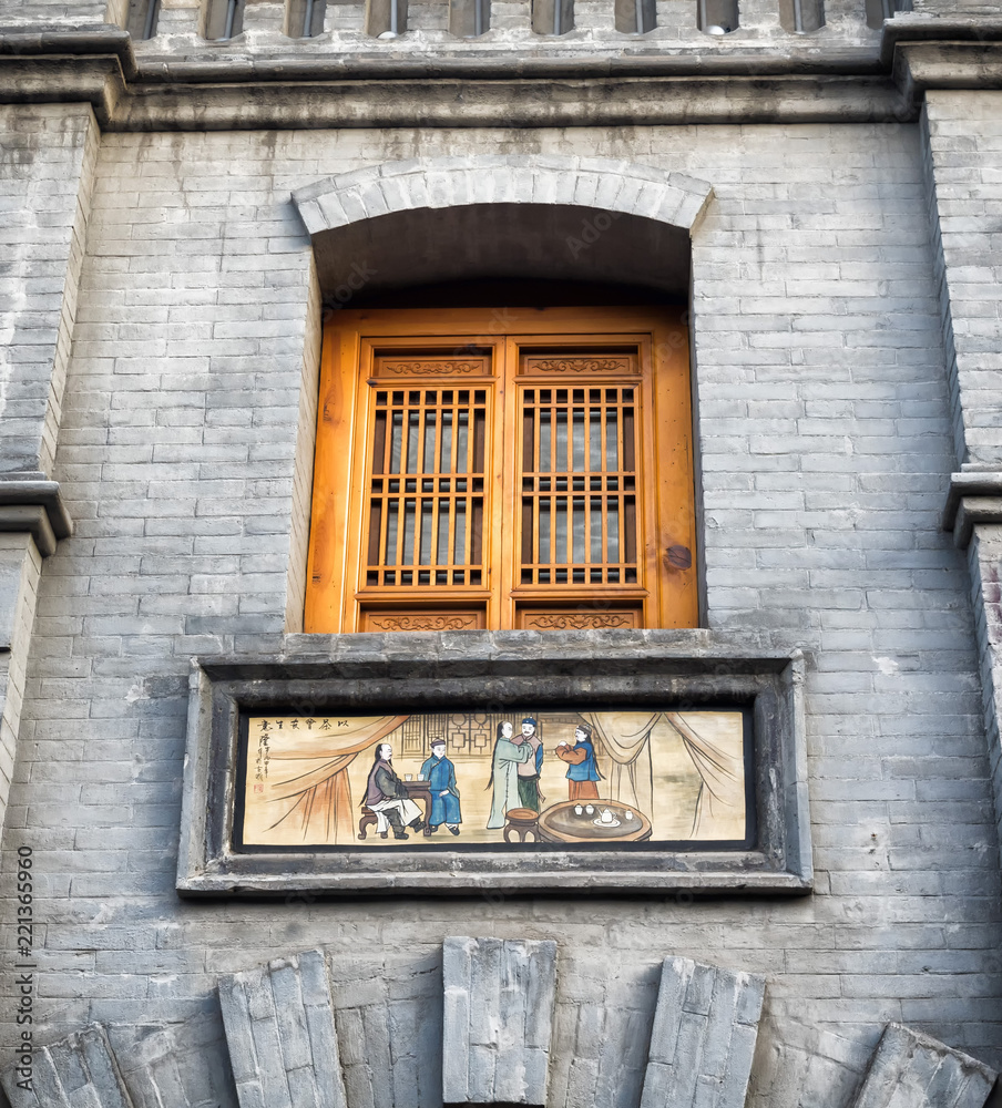 Pingyao Ancient City, Unesco heritage site, China - May 23, 2018: A wooden window and a chinese traditional frame at Pingyao Ancient City, China