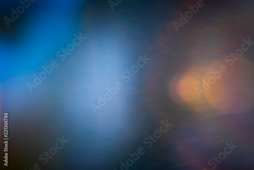 Abstract blurred blue background with yellow rays of light, photo