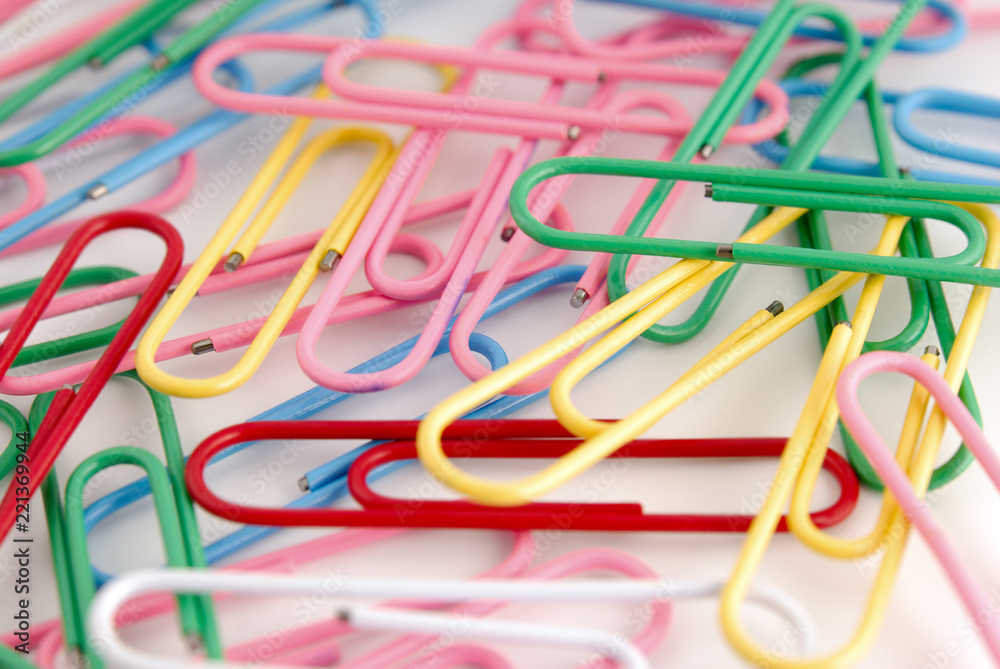 Colored paper clips on white Colored paper clips on white