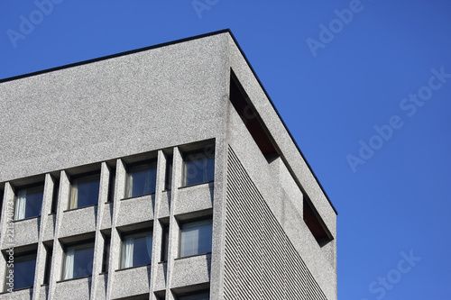 The facade of the building with Windows on the background of blue sky