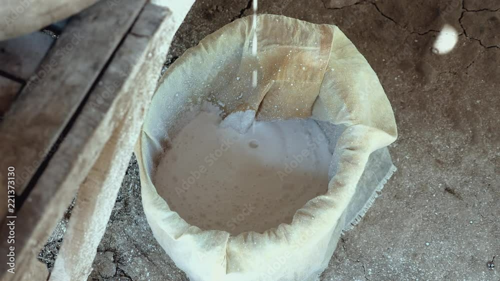 Close-up on soaked rice flour collected out of wet rice grinding with millstone