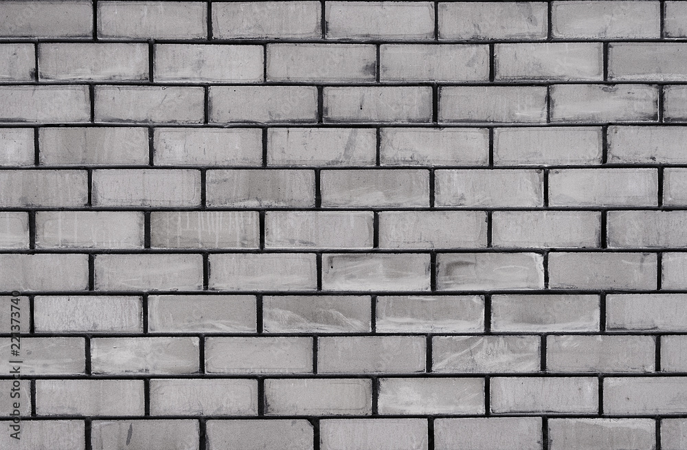New brick wall. New brickwork. Gray brick wall. Brick background.