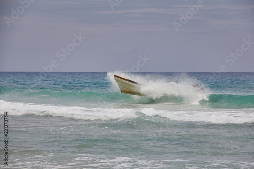 small wooden boat in the sea