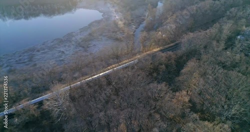 Aerial Pan Around of a Train Passing Through Westchester New York photo