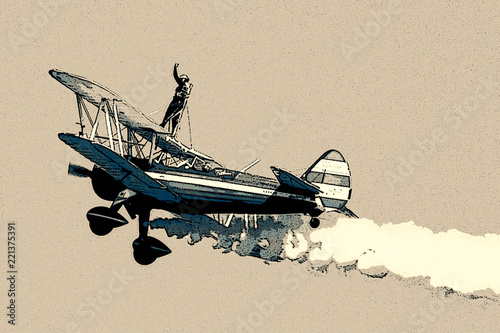 Wing walker on biplane posterized illustration tan background photo