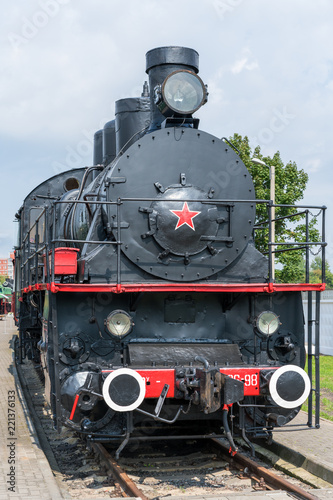 Front view of an old-fashioned steam locomotive