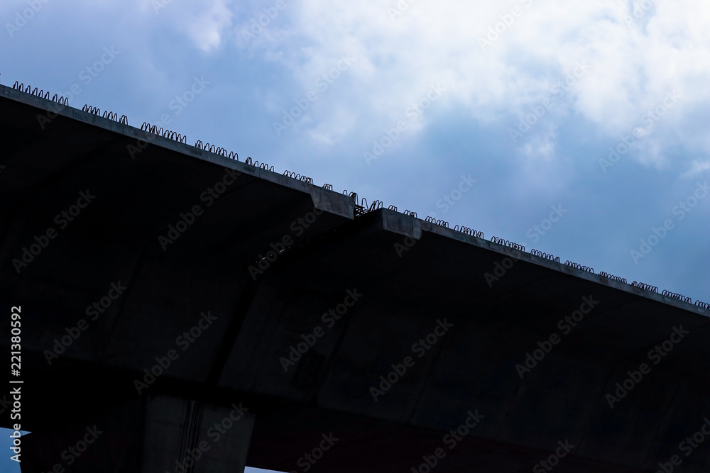 Silhouette of expressway under construction.