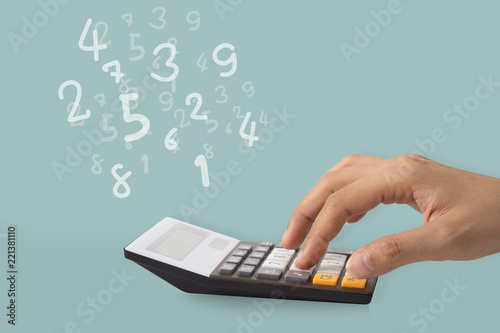 Hand using a calculator to calculate the numbers, Idea concept