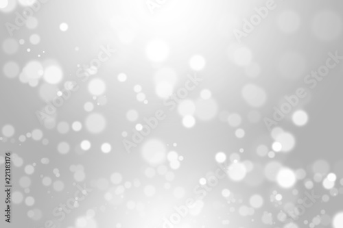 silver bokeh light background beautiful bright blurred glitter effect. decoration for your design