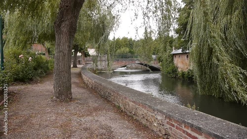 River, bridge and park in Broglie, Normandy France photo