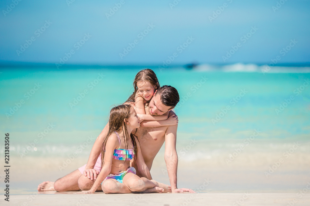 Father and little kids enjoying beach summer tropical vacation