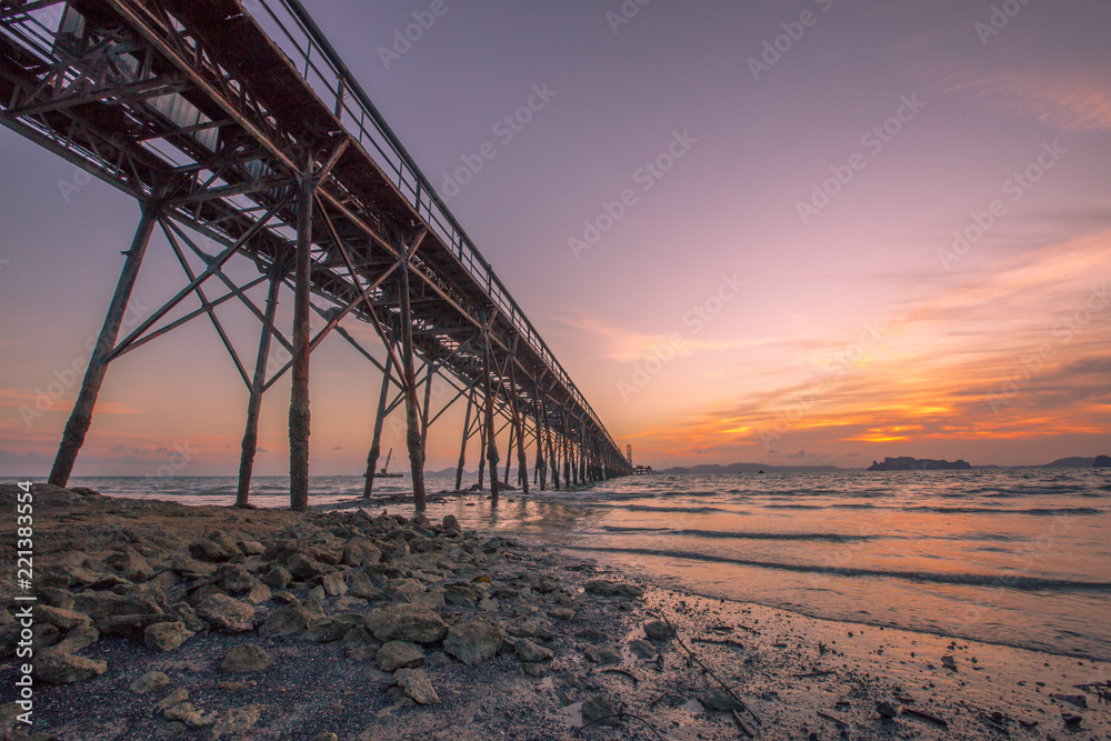 An intimate view of the sea with a beautiful evening light, which constantly changes color and time. Seasonal, mineral mining in the sea to use energy.