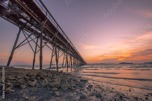 An intimate view of the sea with a beautiful evening light  which constantly changes color and time. Seasonal  mineral mining in the sea to use energy.