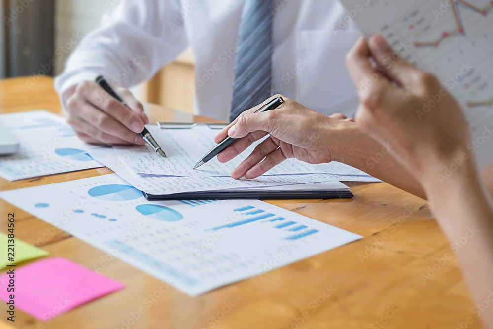Business adviser analyzing financial figures denoting the progress Internal Revenue Service checking document. Audit concept Business adviser analyzing financial figures denoting the progress Internal Revenue Service checking document. Audit concept