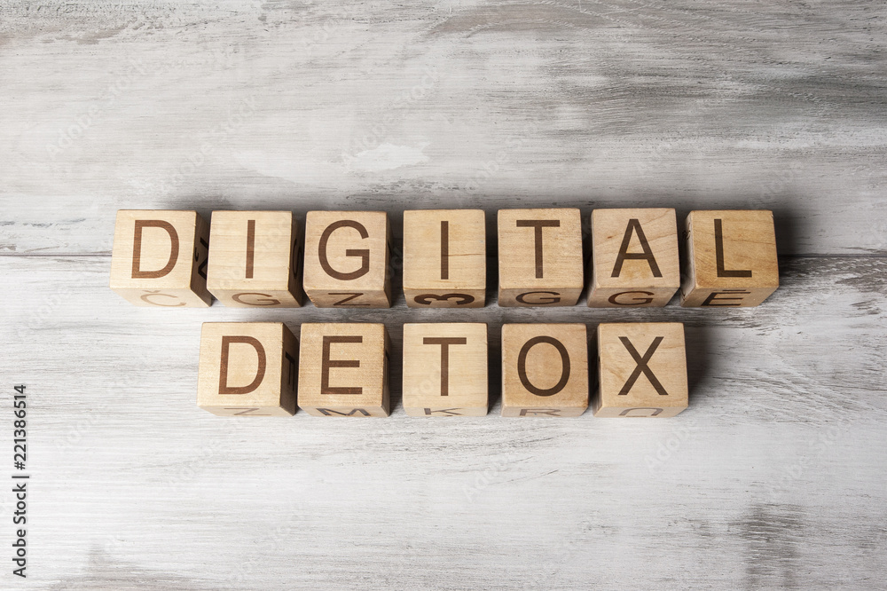 Fototapeta premium DIGITAL DETOX text on wooden cubes on wooden background