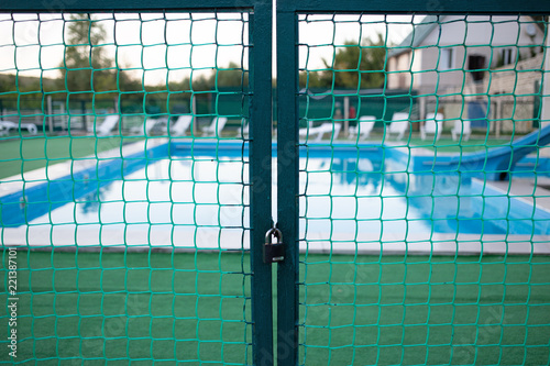 A closed gate at the entrance to the pool photo