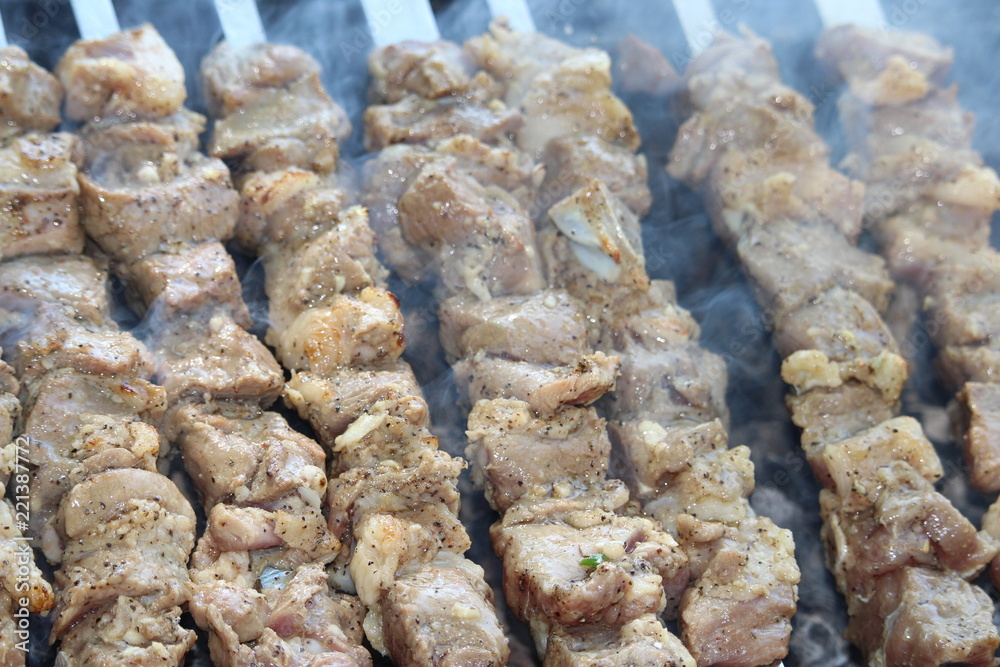 pieces of meat on grill pieces of meat on grill