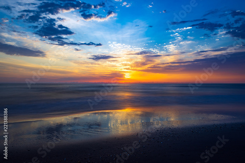 Amazing colorful sunrise at sea, long exposure