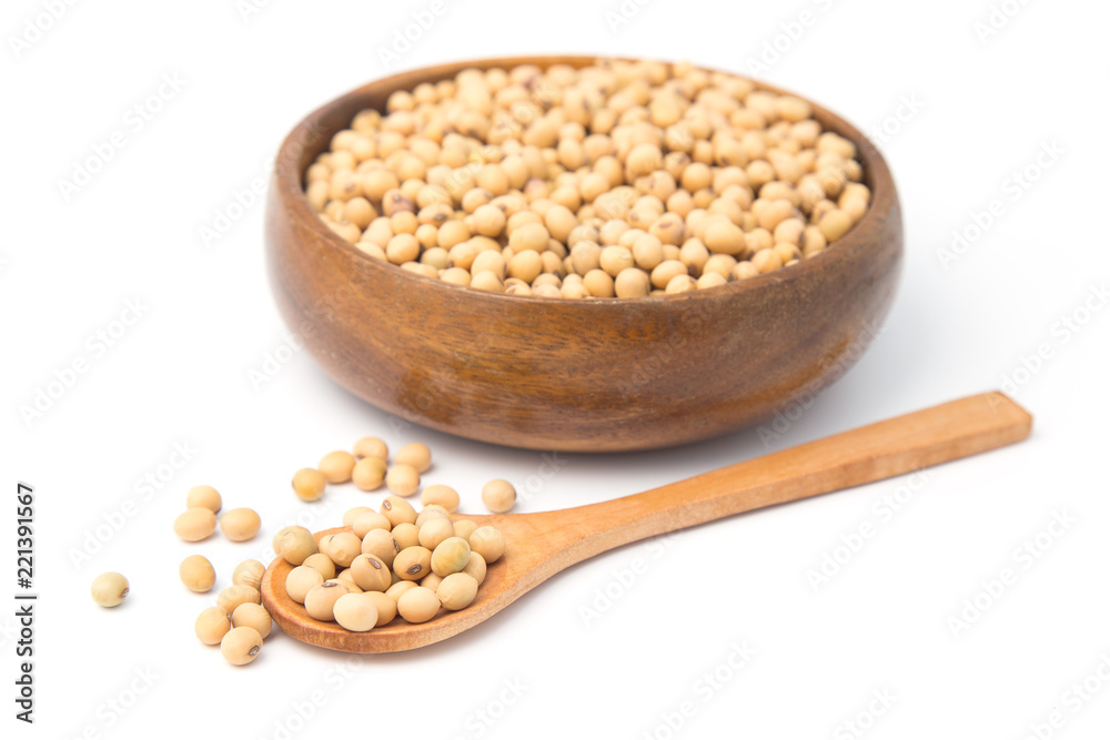Soybeans in wooden bowl and spoon isolated on white background. Soybeans in wooden bowl and spoon isolated on white background.