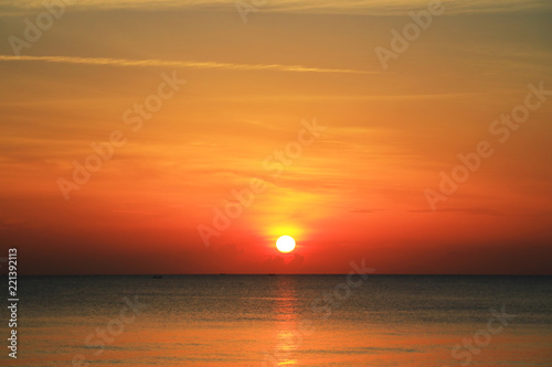 beautiful sunrise on the beach © rathchapon