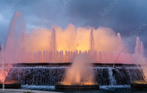 Colorful performance of Magic Fountain of Montjuic in Barcelona  Spain. Show combines a spectacular display of music  water acrobatics and lights which generate over 50 kinds of shades and hues.