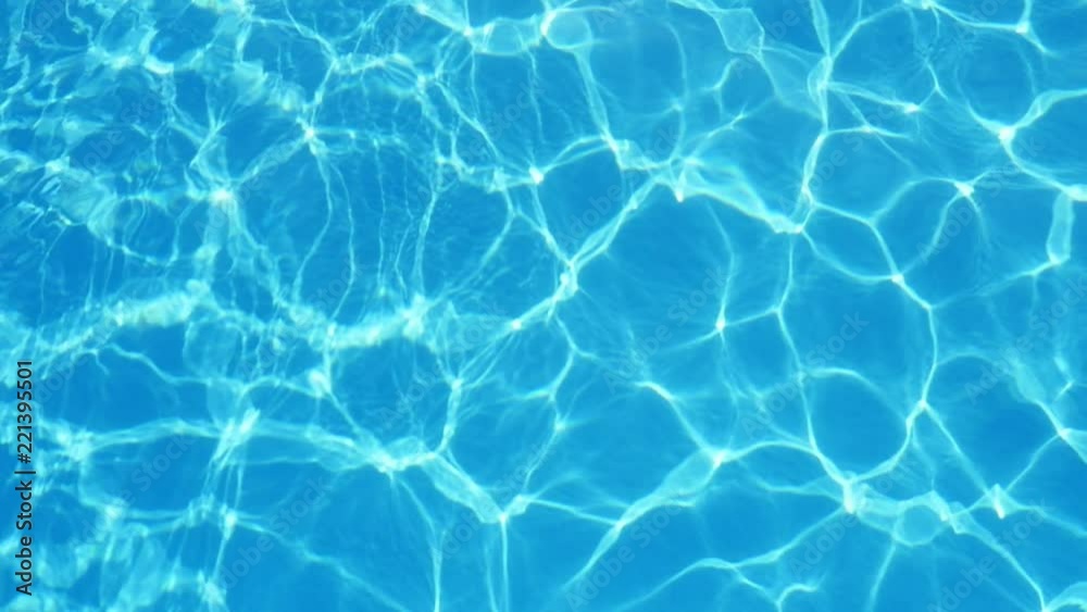 A gorgeous view of swaying celeste waters in an arty pool with sparkling wavy lines shaping a psychedellic and optimistic background. A gorgeous view of swaying celeste waters in an arty pool with sparkling wavy lines shaping a psychedellic and optimistic background.