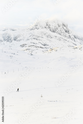 Skier in a snow covered mountain landscape in Beitoslølen Norway