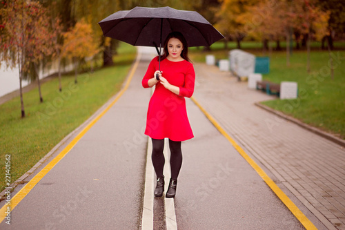 happy girl walks in the autumn park under an umbrella © ribalka yuli