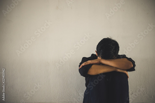 Sad man hug and sitting alone with copy space