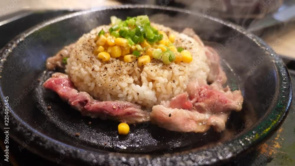 Steamed rice and meat on a hot pan Steamed rice and meat on a hot pan
